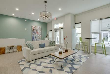 a living room with a couch coffee table and chairs