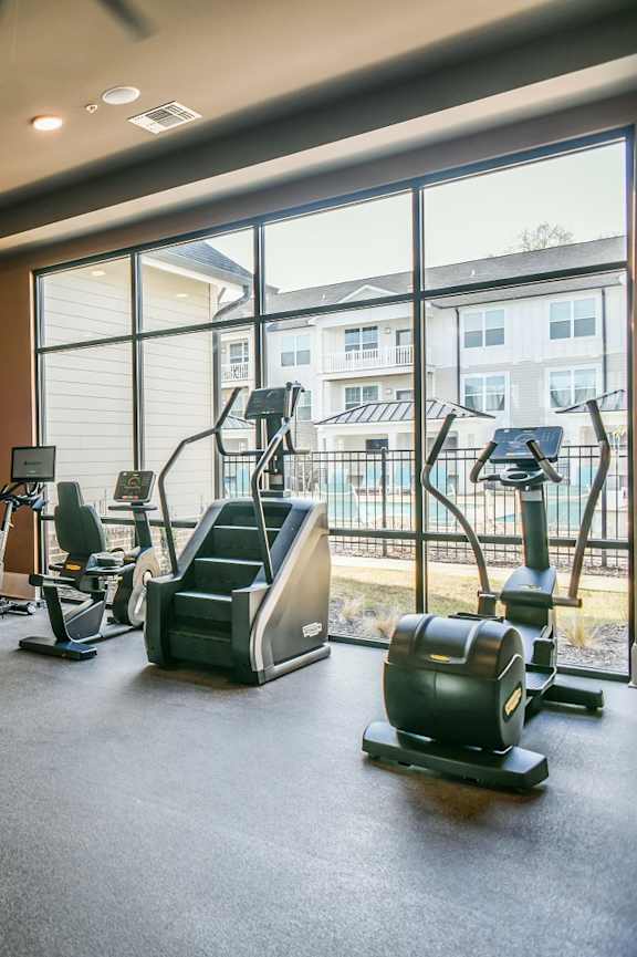 A row of treadmills are lined up in a gym. at Inkwell Greenhouse, Houston, 77084