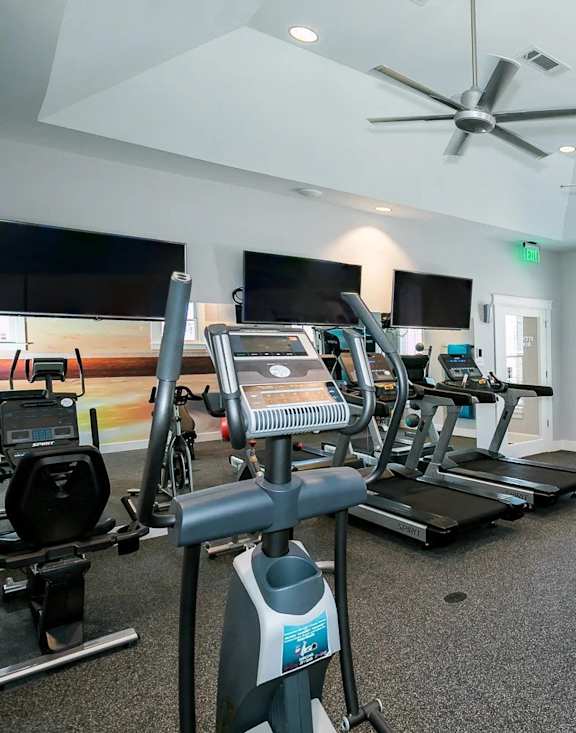 a gym with weights and other exercise equipment in a home