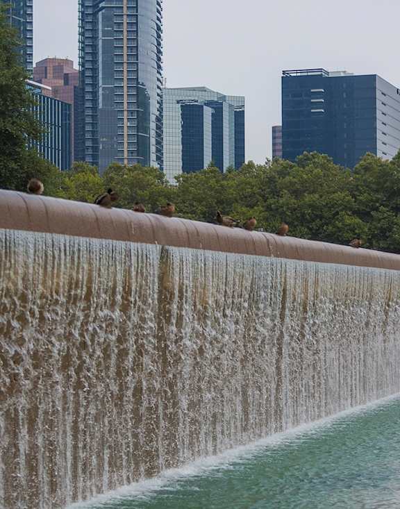 Waterfall Feature and View of City