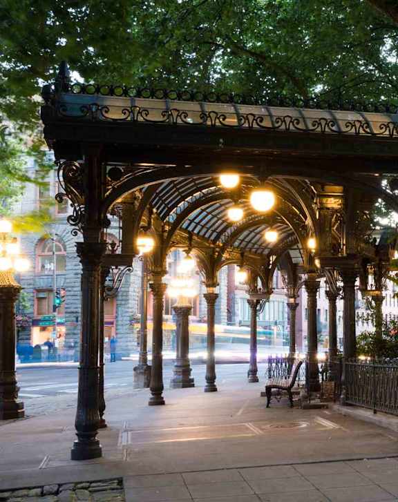 a row of street lights on a sidewalk