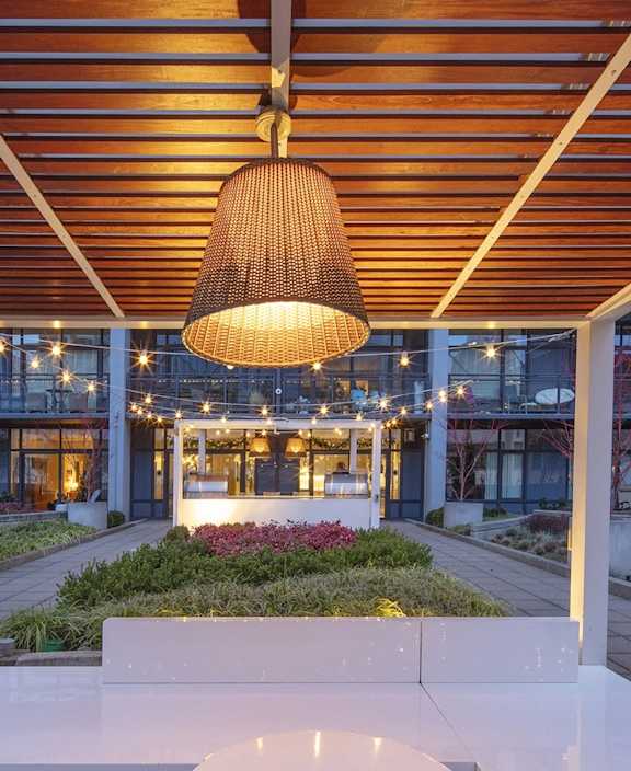 a view of the lobby of an office building with a pendant light