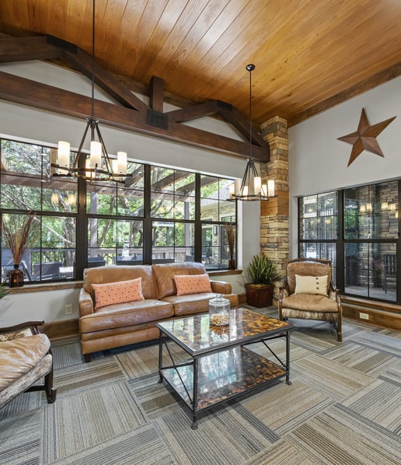 a pool with lounge chairs and umbrellas at the oxford at the boulevard apartments