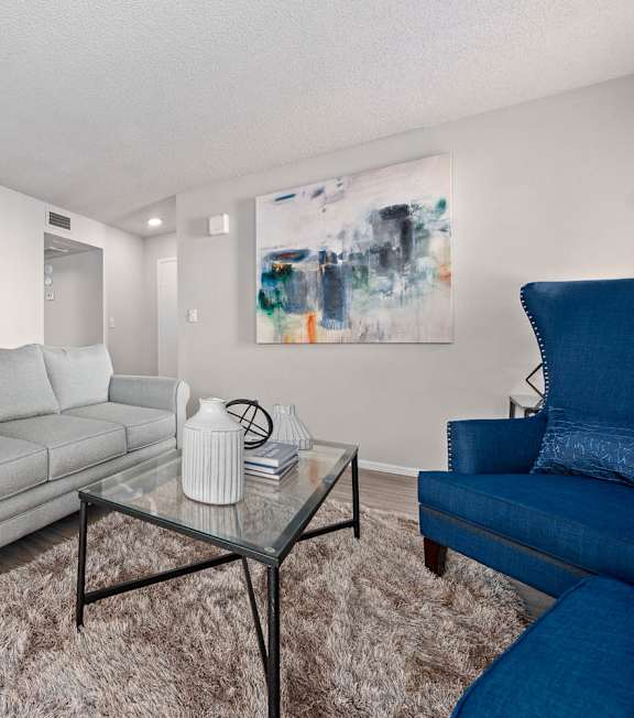 Furnished living room with modern decor at Serafina at South Mountain apartments in Ahwatukee, AZ.