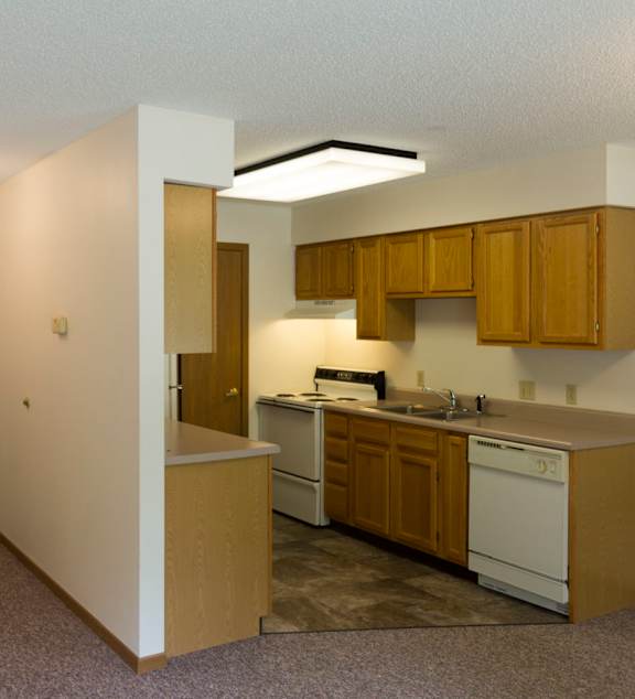 a bedroom with a large bed and a ceiling fan