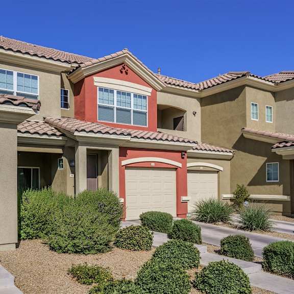 A row of houses with brown and tan exteriors.