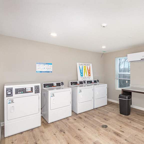 Laundry room with washers and dryers.