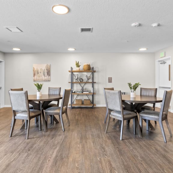 a dining room with a table and chairs