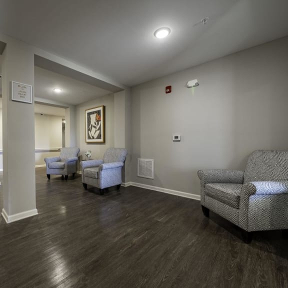 a living room with couches and chairs