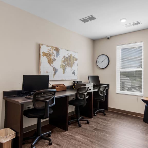 our office is equipped with computers and a large map of the world