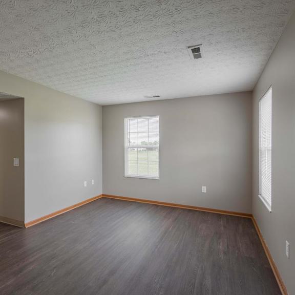 A room with a window and a door.