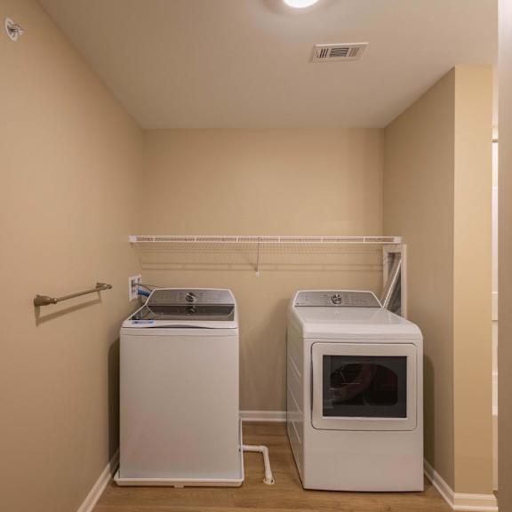 A laundry room with a washer and dryer.