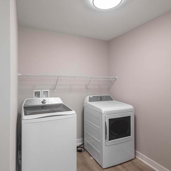 A laundry room with a washer and dryer.