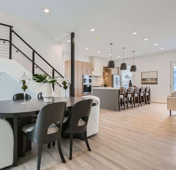 a dining room with a table and chairs at One West Drive Apartments, Excelsior, Minnesota