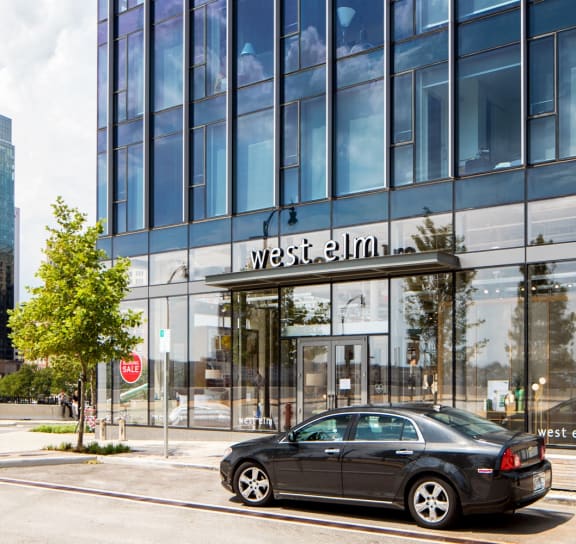 a black car parked in front of a glass building at 1305 Dock Street, Maryland, 21231