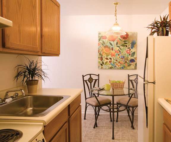 An empty bedroom with a window at Bristol Square Apartments.