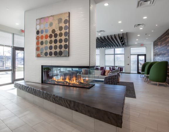 the lobby of a building with a fireplace