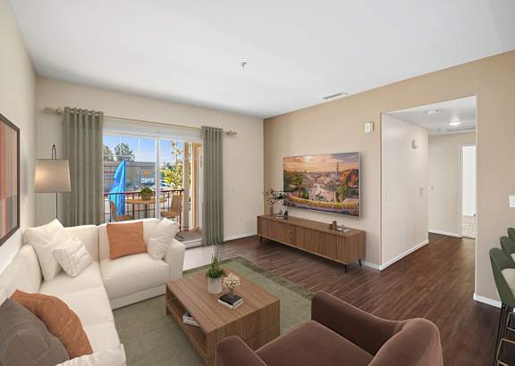 A living room with a white couch, a brown armchair, and a wooden coffee table.