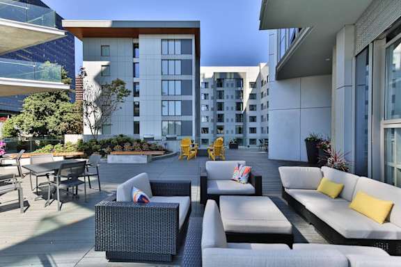 Outdoor terrace with seating at Soma Towers apartments in Bellevue, WA