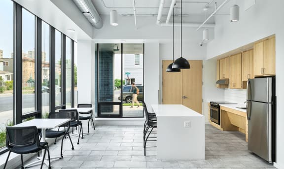 an open kitchen and dining area in an office building
