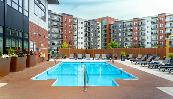 Pool With Relaxing Chairs at Latitude 49 Townhomes, Manitoba, R3X 0M1