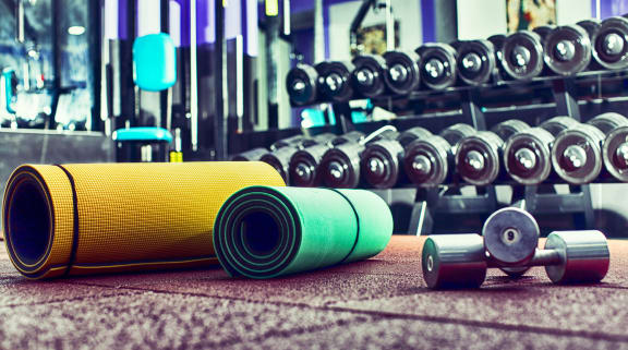 a bunch of exercise mats and dumbbells in a gym at 2929 on Mayfair, Wauwatosa, WI, 53222