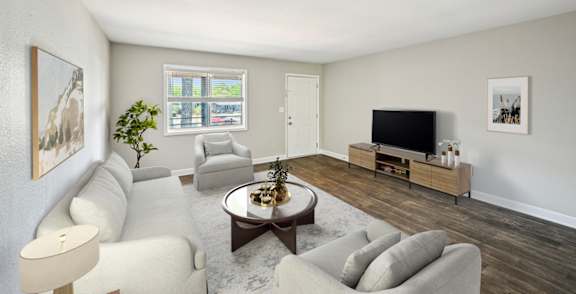 Living room in pet-friendly Marietta GA apartment with bright windows and neutral colors