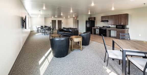 A modern open plan living and dining area with a kitchen.