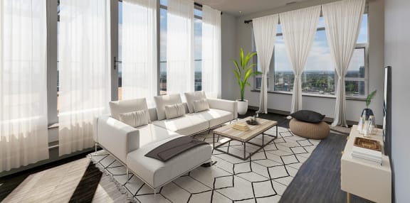 a living room with a white couch and a table at Versus, Calgary, Alberta, T2R 1A8