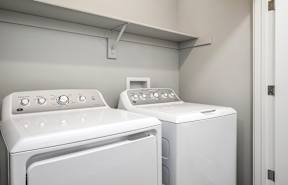A laundry room with a washer and dryer.