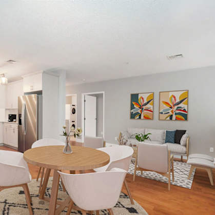 a living room and dining room with a table and chairs