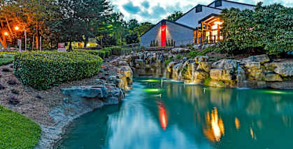 Pond with apartment in background