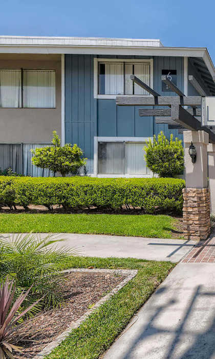 A sunny day at the Landing residential complex with a clear blue sky.