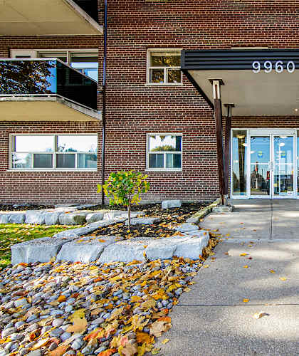 a large brick building with a glass door