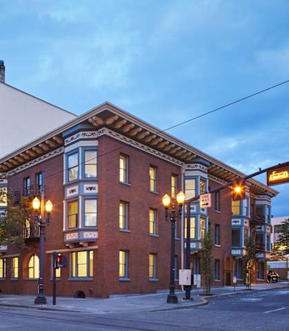 A street view of a building with a sign that reads "Nash".