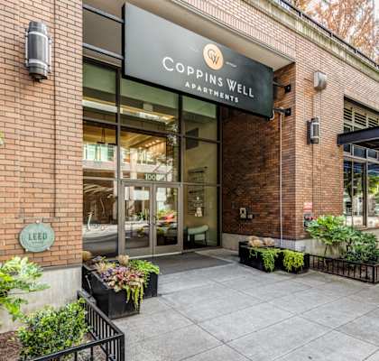 the facade of a building with a sign that reads coppingwell restaurant