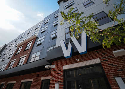 A modern building with a large W on the top. at Walnut View Apartments, Allentown, PA, 18102