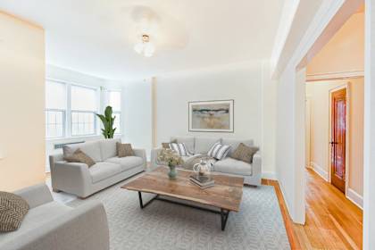 a living room with couches and a coffee table
