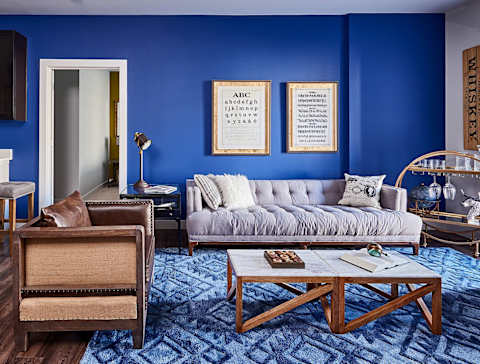 A living room with a grey couch at Waterstone at Hamburg Apartments, KY 40509