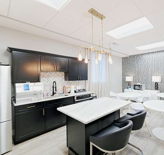 a kitchen and dining area in a 555 waverly unit