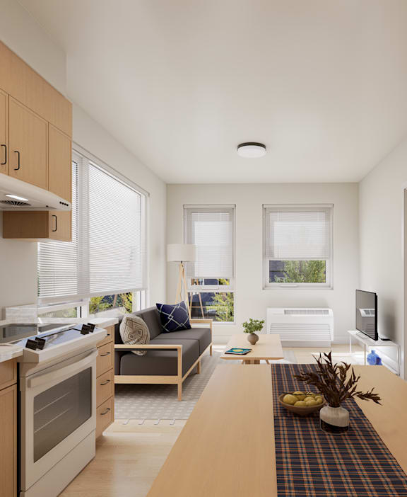 A modern kitchen with wooden cabinets and a dining table set for two.