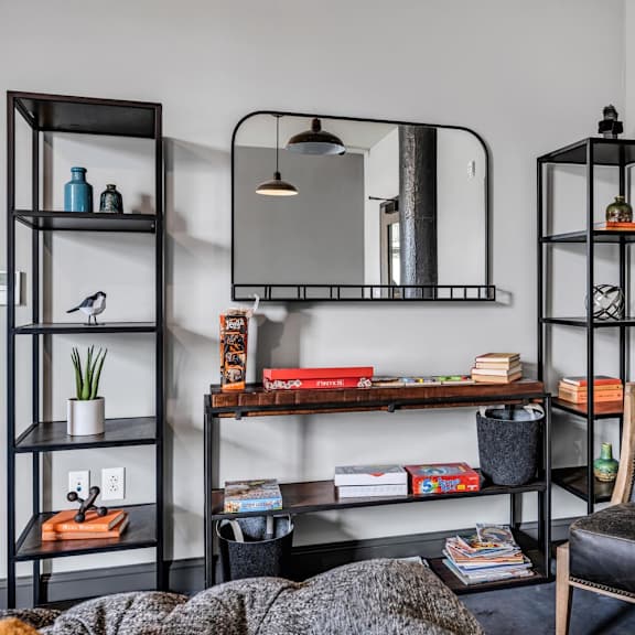 a bedroom with a bed and a mirror