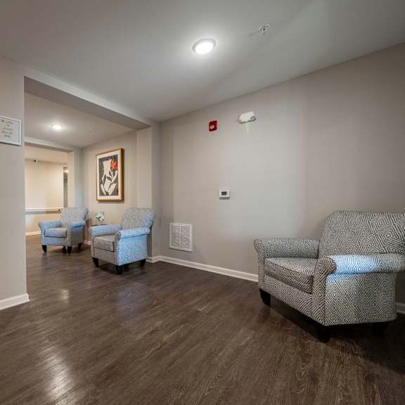 a living room with couches and chairs