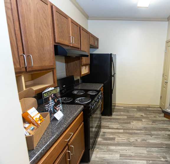 a kitchen with a stove a sink and a refrigerator