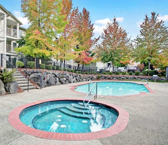 A small pool with a red border and a ladder in the middle.