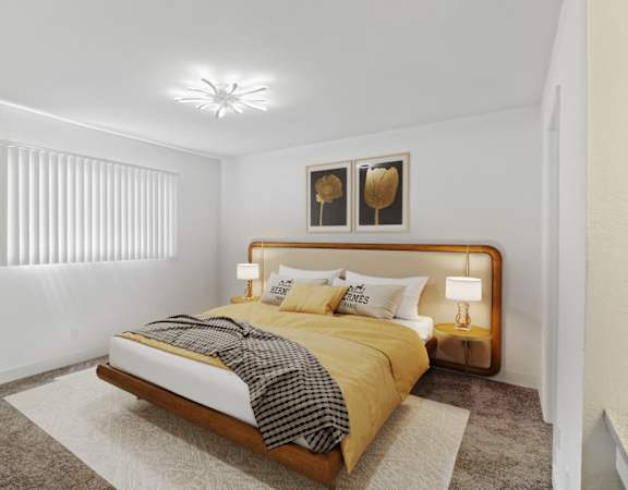 a bedroom with a bed and two lamps