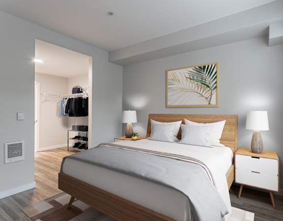 a bedroom with a large bed and a closet in a 555 waverly unit