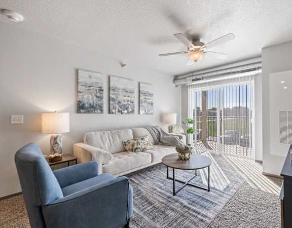 Spacious living room with neutral walls and ample natural light.