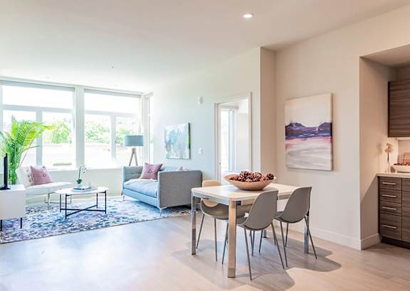 a living room with a table and chairs and a couch in the background at Second & B Street, San Rafael, 94901