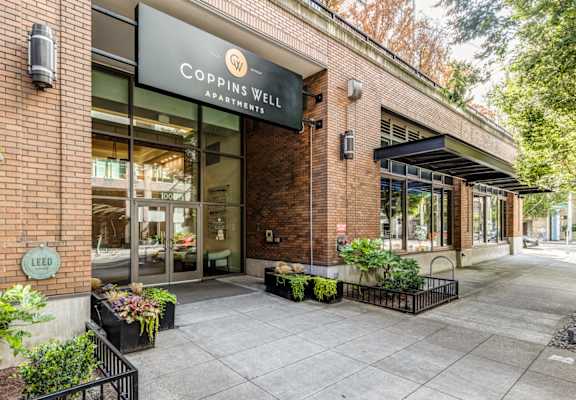 the facade of a building with a sign that reads coppingwell restaurant
